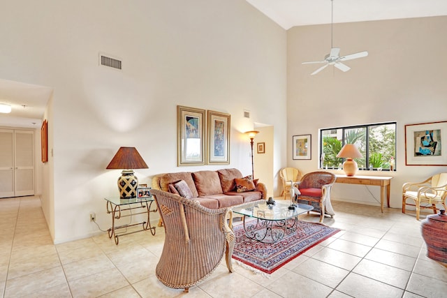 tiled living room featuring high vaulted ceiling and ceiling fan