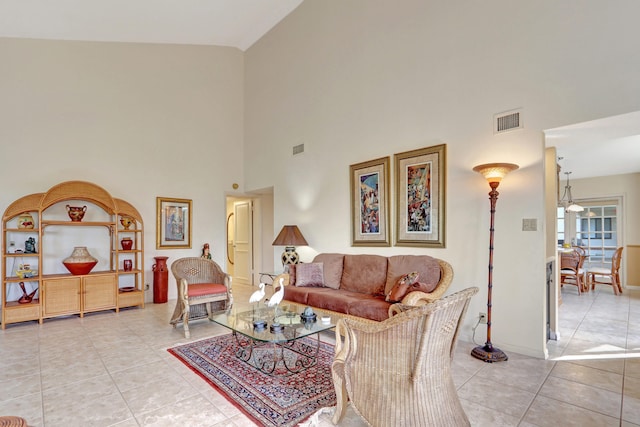 tiled living room featuring high vaulted ceiling