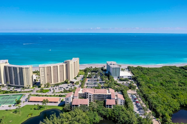 birds eye view of property featuring a water view and a view of the beach