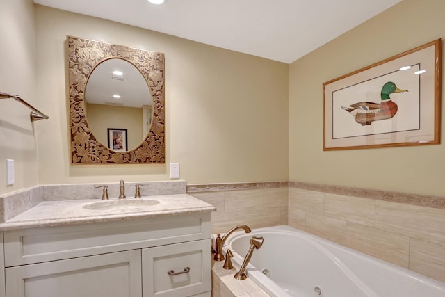 bathroom with vanity and a relaxing tiled tub