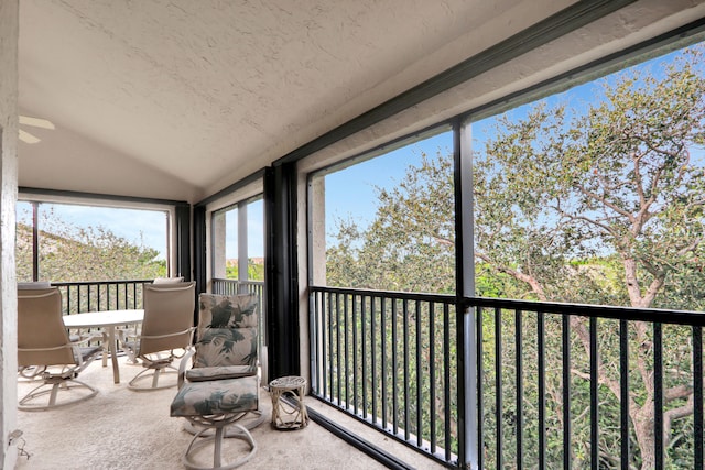 sunroom / solarium with vaulted ceiling