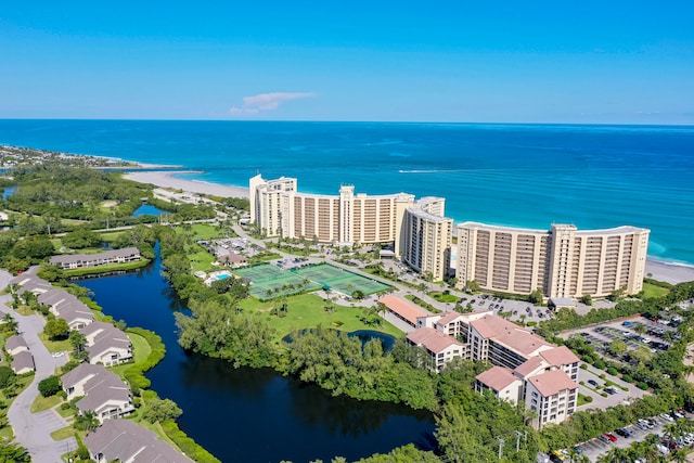 aerial view featuring a water view and a beach view