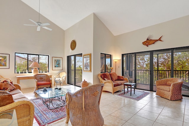 living room with high vaulted ceiling, ceiling fan, and light tile patterned flooring