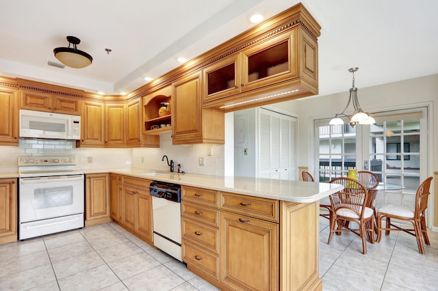 kitchen with decorative backsplash, white appliances, kitchen peninsula, light tile patterned floors, and decorative light fixtures