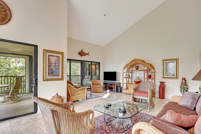 living room with high vaulted ceiling and light tile patterned floors