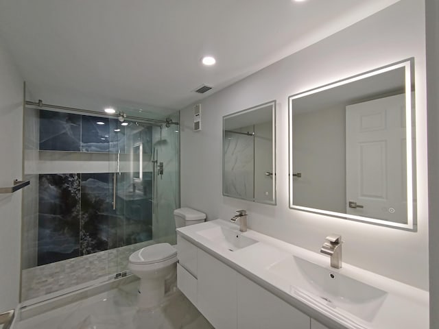 bathroom with walk in shower, vanity, and toilet