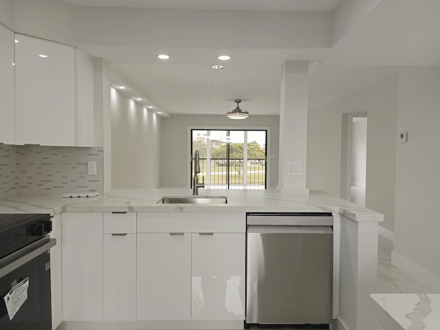 kitchen featuring white cabinetry, light stone counters, kitchen peninsula, dishwasher, and sink