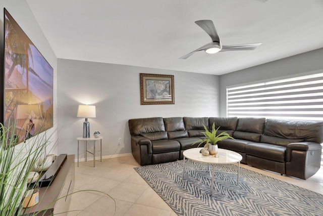 tiled living room with ceiling fan