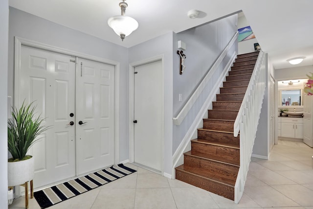 foyer with light tile patterned flooring