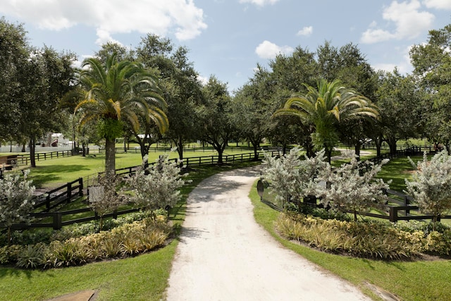 view of home's community with a yard and a rural view