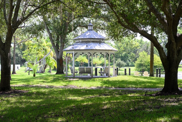 view of community featuring a lawn and a gazebo