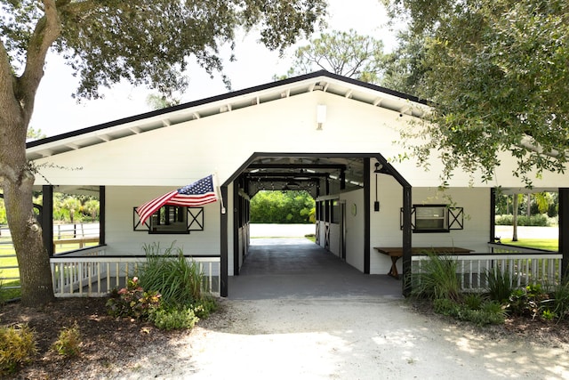 view of vehicle parking featuring a carport