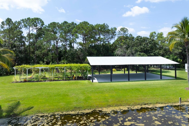 view of home's community with a yard and a carport