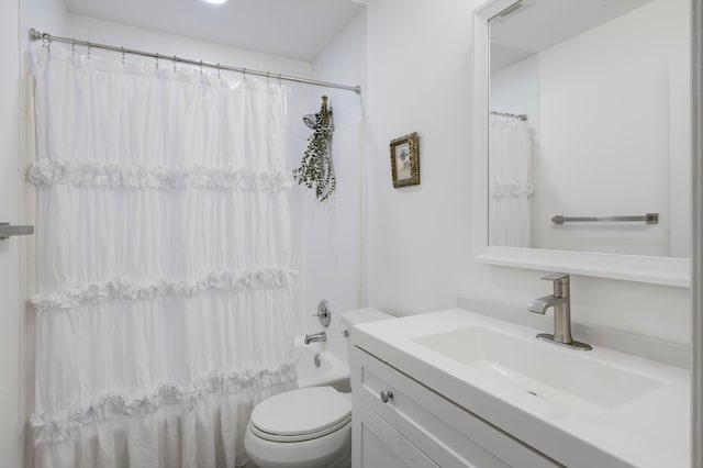 full bathroom featuring vanity, toilet, and shower / tub combo with curtain