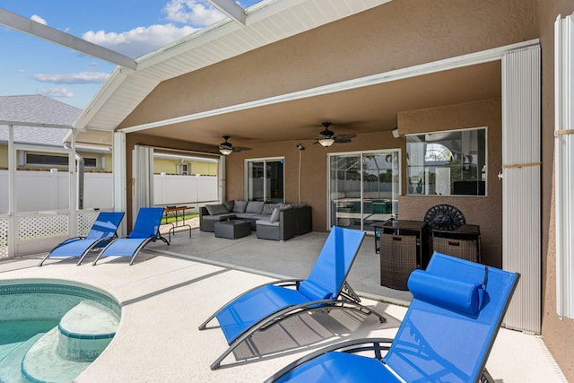 view of patio featuring ceiling fan, an outdoor living space, and a fenced in pool