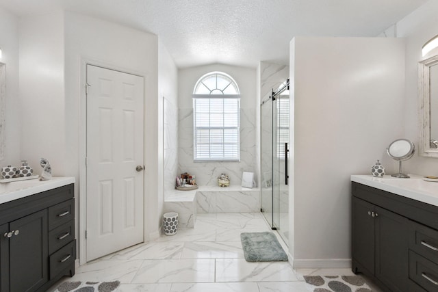 bathroom featuring tile patterned flooring, a textured ceiling, vanity, and shower with separate bathtub