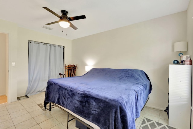 bedroom with light tile patterned floors and ceiling fan