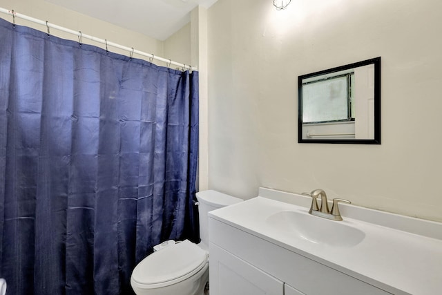 bathroom with a shower with shower curtain, toilet, and vanity