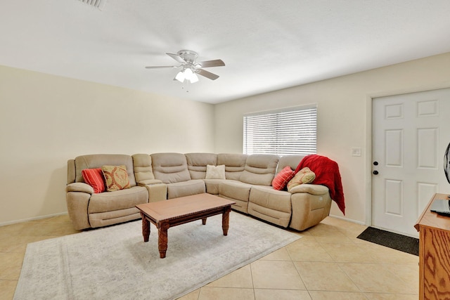 tiled living room featuring ceiling fan