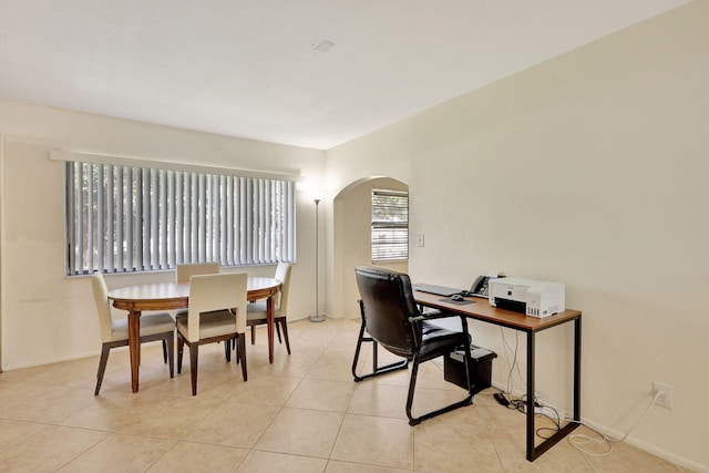 tiled office featuring a wealth of natural light