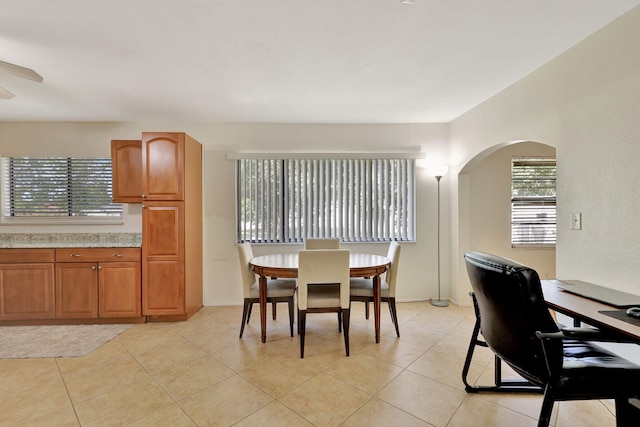 dining area featuring plenty of natural light and light tile patterned floors