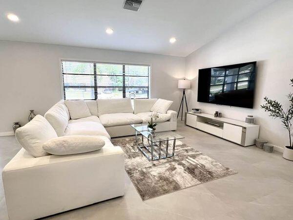 living room with vaulted ceiling