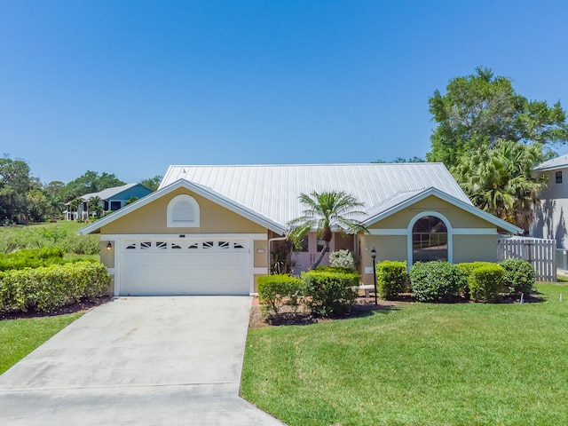 ranch-style home with a garage and a front yard