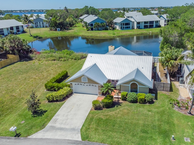 birds eye view of property with a water view