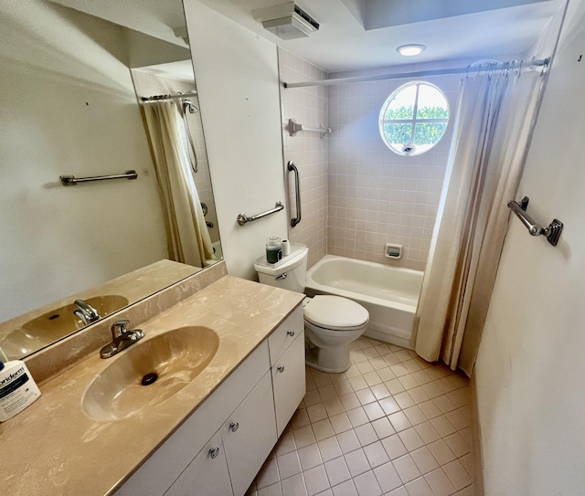 full bathroom with vanity, toilet, tile patterned floors, and shower / bath combo with shower curtain