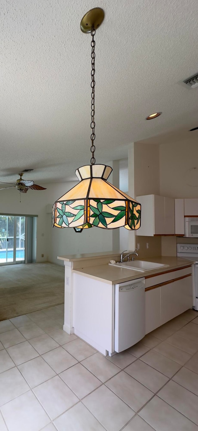 kitchen with ceiling fan, sink, light tile patterned floors, and white appliances