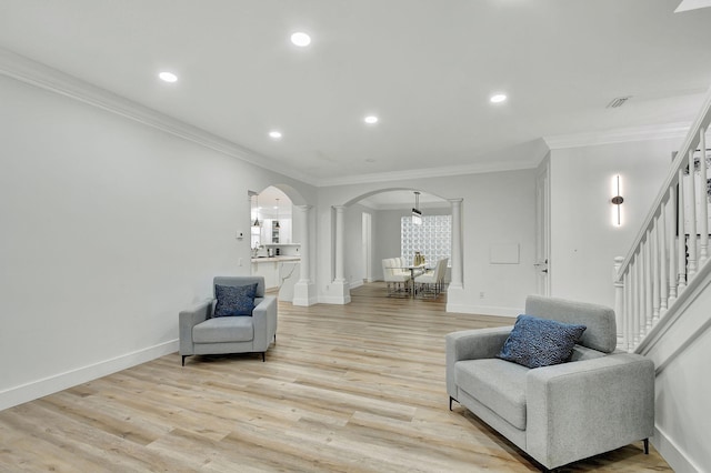 sitting room featuring light hardwood / wood-style floors and ornamental molding