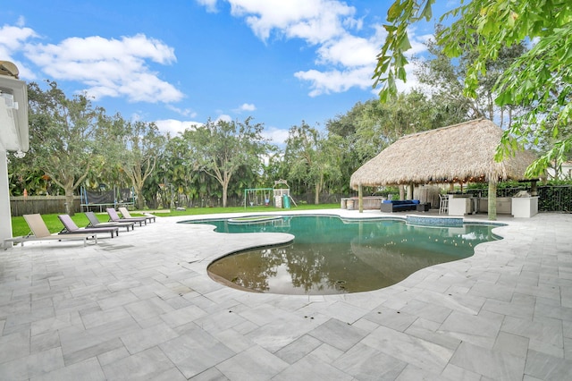 view of swimming pool featuring a patio