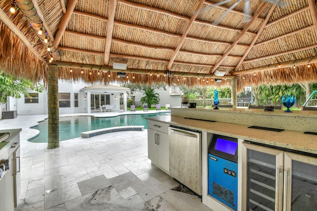 view of pool with a patio, cooling unit, and a gazebo