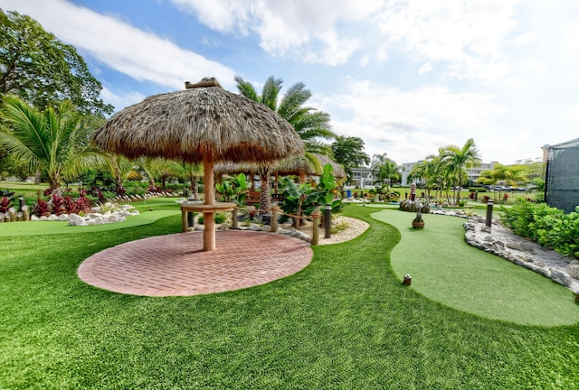 view of property's community with a lawn and a gazebo