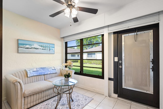 dining area with ceiling fan, light tile patterned floors, and a textured ceiling