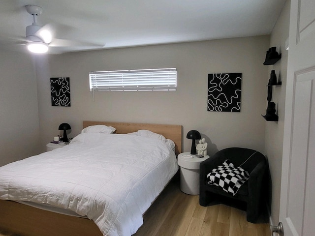 bedroom featuring hardwood / wood-style flooring and ceiling fan