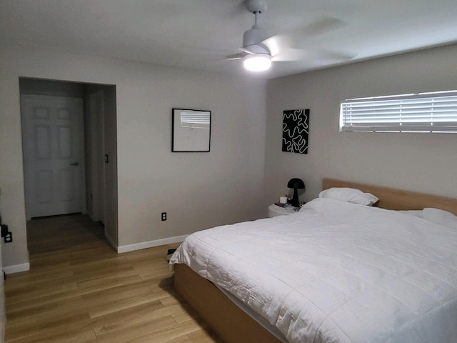 bedroom featuring light hardwood / wood-style floors and ceiling fan