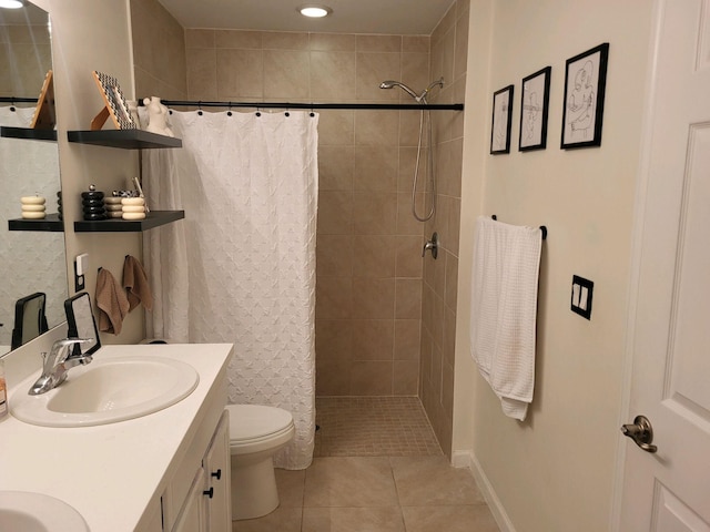 bathroom featuring walk in shower, tile patterned flooring, vanity, and toilet