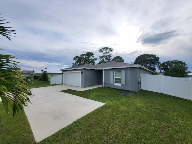 ranch-style home with a garage and a front yard