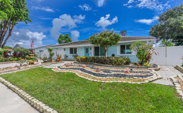 single story home with a front yard