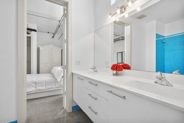 bathroom featuring vanity, walk in shower, and concrete flooring