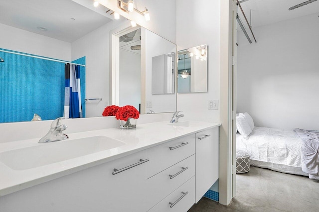 bathroom with vanity, concrete floors, and a shower with curtain