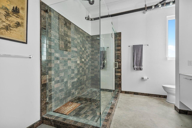 bathroom with toilet, an enclosed shower, and concrete flooring