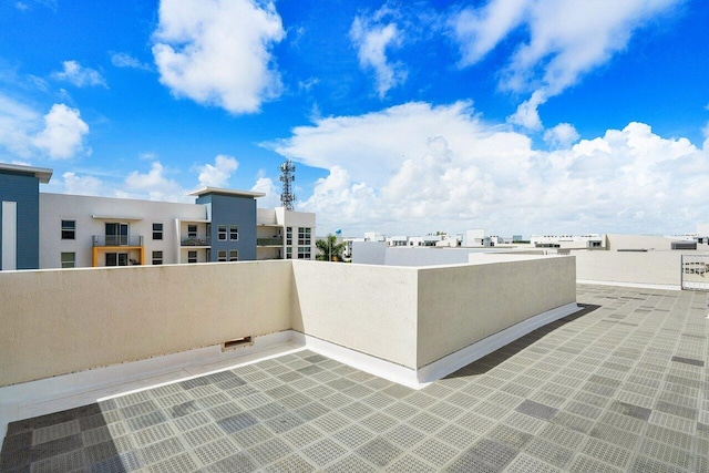 view of patio featuring a balcony