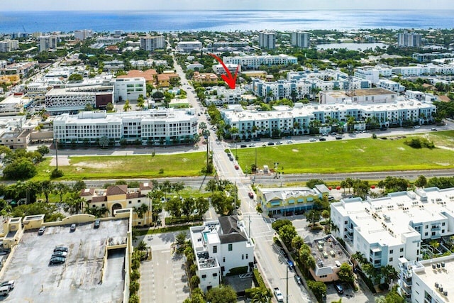 birds eye view of property with a water view