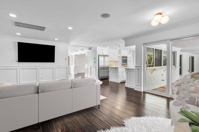 living room featuring crown molding and dark hardwood / wood-style flooring