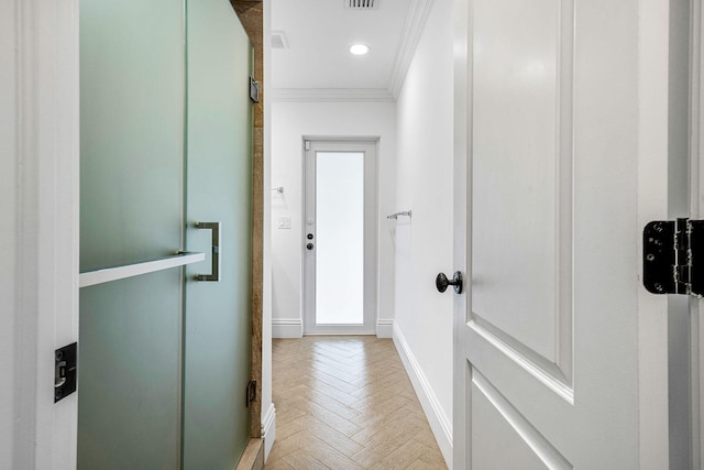 hall featuring crown molding and light parquet flooring