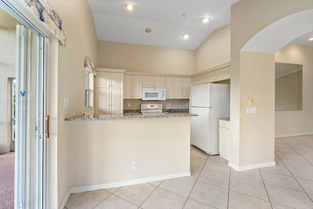 kitchen featuring light stone counters, high vaulted ceiling, light tile patterned floors, kitchen peninsula, and white appliances