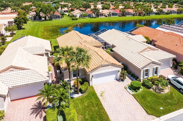 birds eye view of property featuring a water view and a residential view