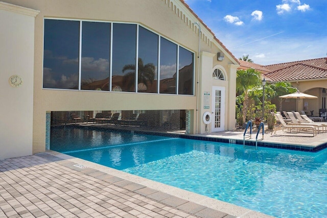 view of swimming pool with a patio area